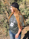 Cactus Deer Logo T shirt from River to Ridge Clothing Brand with a deer skull with antlers made out of cactus in green - on a woman with red hair