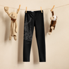 Kids leggings with a red stag deer on them in black. Hanging on a clothing line