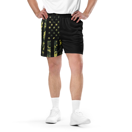 Man wearing river to ridge clothing brand camo flag shorts in black and green, gym shorts with tennis shoes