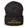 River to Ridge Logo stitched on a beanie. Logo is gold with mountains