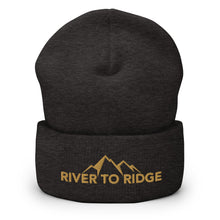  River to Ridge Logo stitched on a beanie. Logo is gold with mountains