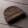 Product mockup of a fisherman's style skull cap beanie from River to Ridge Clothing Brand with the mountain logo on it