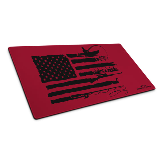 River to Ridge Brand Cleaning Mat with the Sportsmans Flag Logo on it in red and black with fishing, elk antlers and ducks and the USA flag