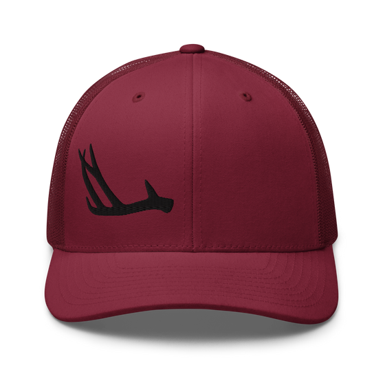 Product mockup of an antler logo shed hunting hat from River to Ridge Clothing company with a deer antler stitched on it on one side of the front