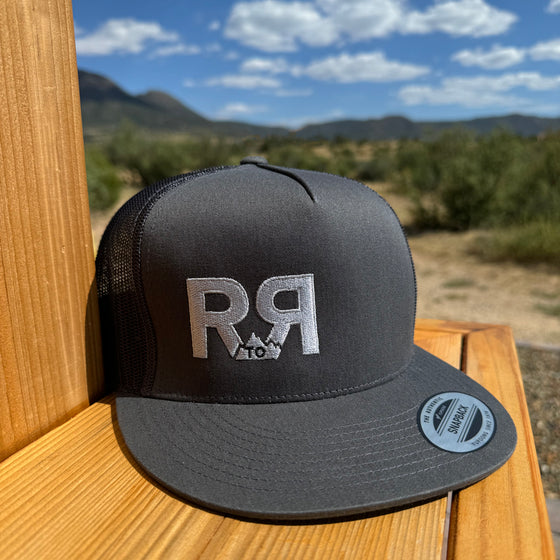 R to R River to Ridge Clothing Brand Logo Trucker Hat in charcoal with silver stitching