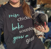 Women's T Shirt that says Raise Chickens, bake sourdough, grow a garden from the brand River to Ridge Clothing - worn by a woman holding a chicken