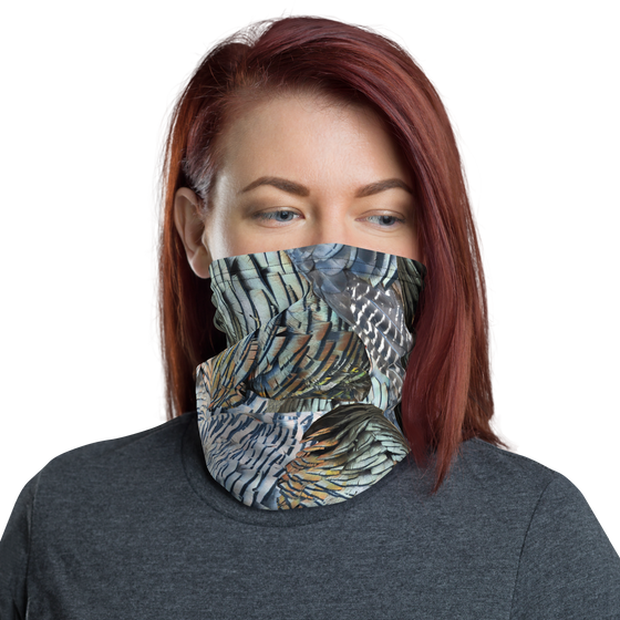 Woman wearing a face gaiter from River to Ridge Brand with Turkey Feather Pattern