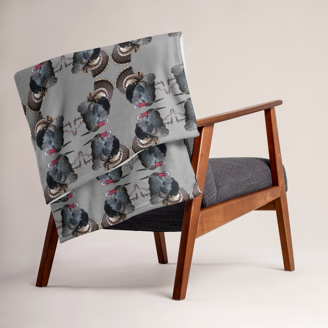  Turkey Hunting Logo Fleece Throw Blanket from River to Ridge Clothing Brand on the back of a chair