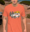 River to Ridge Clothing Brand orange men's T shirt on a guy offroading outdoors, logo is a vintage truck camping / overlanding in the forest with an international scout 4x4