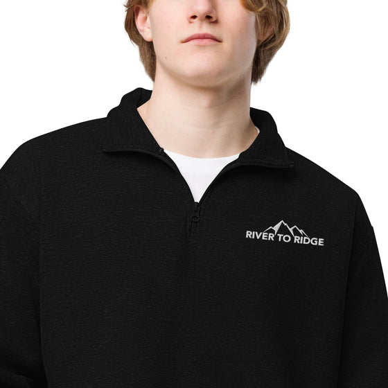 Product mockup of a River to Ridge Brand Fleece Pullover half zip with the embroidery logo on it