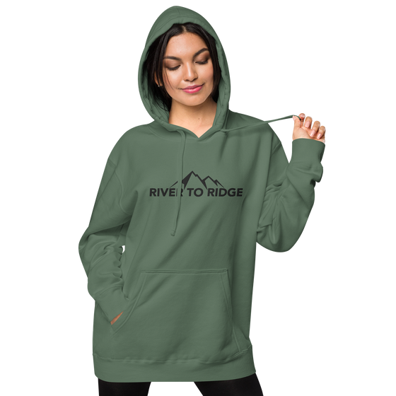 River to Ridge Clothing Brand Womens Vintage Wash Hoodie in green with embroidered logo on chest and sleeve in black - worn by a pretty woman