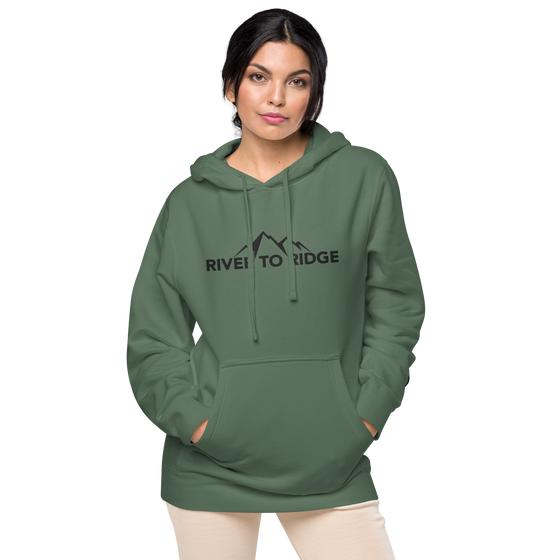 River to Ridge Clothing Brand Womens Vintage Wash Hoodie in green with embroidered logo on chest and sleeve in black - worn by a pretty woman