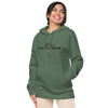 River to Ridge Clothing Brand Womens Vintage Wash Hoodie in green with embroidered logo on chest and sleeve in black worn by a pretty woman