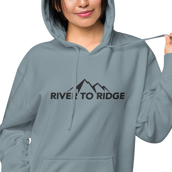 Indigo Blue Womens Hoodie with the River to Ridge Clothing Mountain Logo embroidered on the chest and cuff of sleeve.