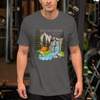 Christian Scripture T Shirt from River to Ridge Clothing Brand with an outdoor scene and waterfall and tent by a river and Isaiah 12:3