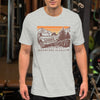 Man wearing a T shirt featuring a Jeep offroad and saying Adventure Is Calling from River to Ridge Clothing Brand at the gym