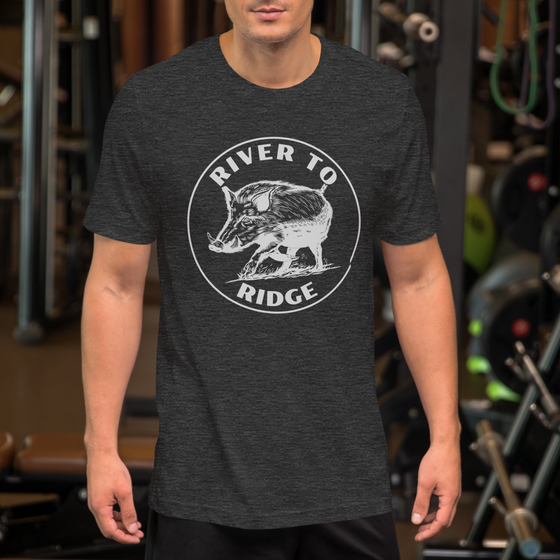 River to Ridge Brand Men's T shirt with a Hog Hunting Logo on it in white, worn by a man at the gym