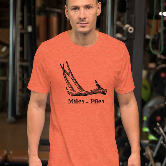 Product mockup of a Miles = Piles Shed Hunting T Shirt from River to Ridge Clothing Brand with a Deer Antler on it