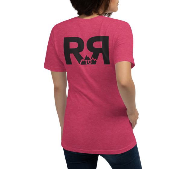 Raspberry colored T Shirt for women with the River to Ridge clothing brand logo on the back, worn by a woman in jeans