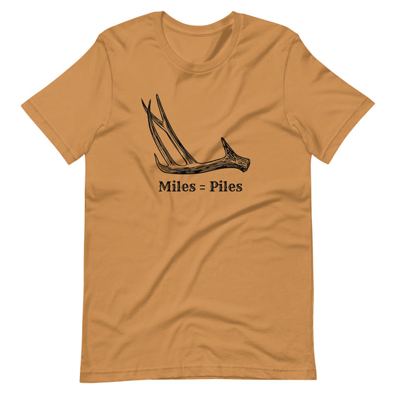 Product mockup of a Miles = Piles Shed Hunting T Shirt from River to Ridge Clothing Brand with a Deer Antler on it