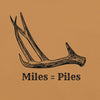 Product mockup of a Miles = Piles Shed Hunting T Shirt from River to Ridge Clothing Brand with a Deer Antler on it