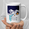 Product mockup of a Christian Outdoor Lifestyle Coffee Mug from River to Ridge Clothing Brand with a mountain scene and tent and uplifting words.