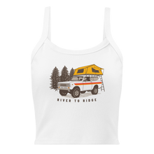  Vintage truck camping logo on a white tank top, International Scout with tent on top for offroading / overlanding adventures and pine trees on a womens top for River to Ridge Clothing Brand